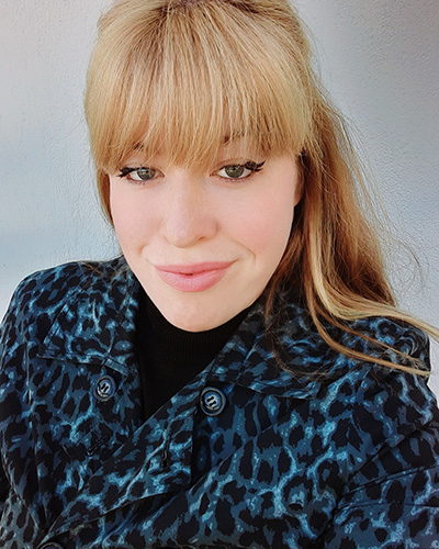 Lucy Kiely in blue leopard print coat